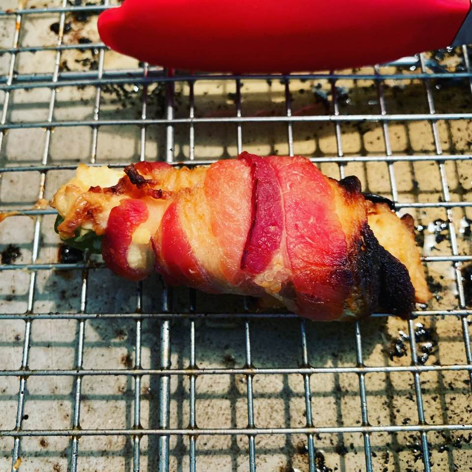 Delicious jalapeno poppers are stuffed with cream cheese and then wrapped in bacon.