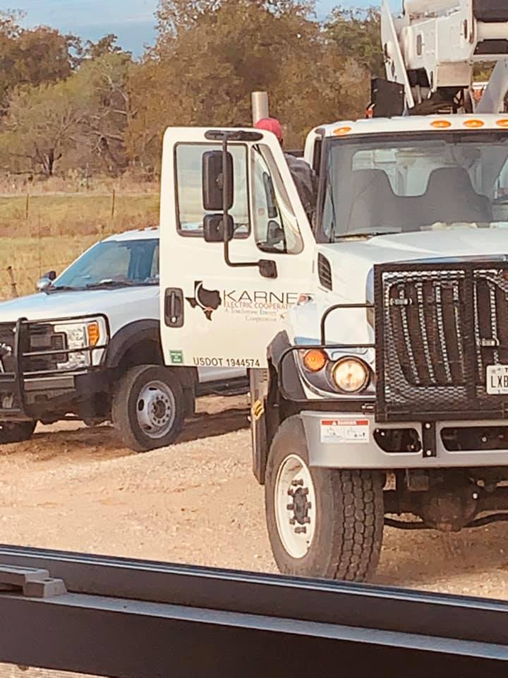 The electric company sent four trucks over for the job.