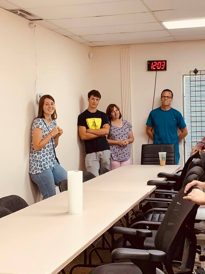 Because there are too many of us to eat a restaurant, we all gathered at tables in office to say goodbye to Bethany, left. Also pictured are her brother Stephen, and their parents.