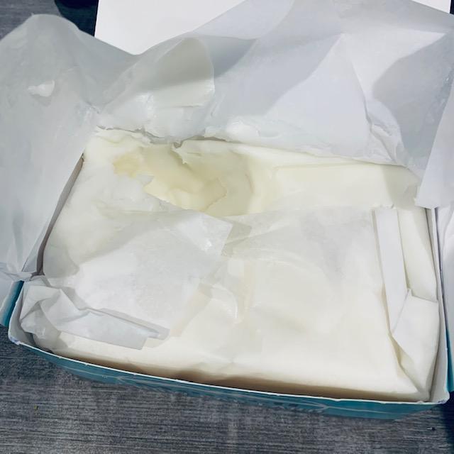 Lard comes wrapped in white paper. The lard itself is pure white (not yellow like in the photo) and it does not smell or taste like meat. The pork fat was rendered so it would have a long shelf life.