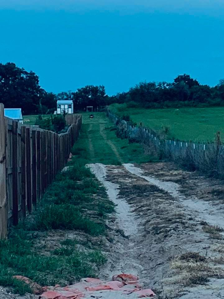 Way up at the top of the hill, you can see our new mower stuck in the sand again.