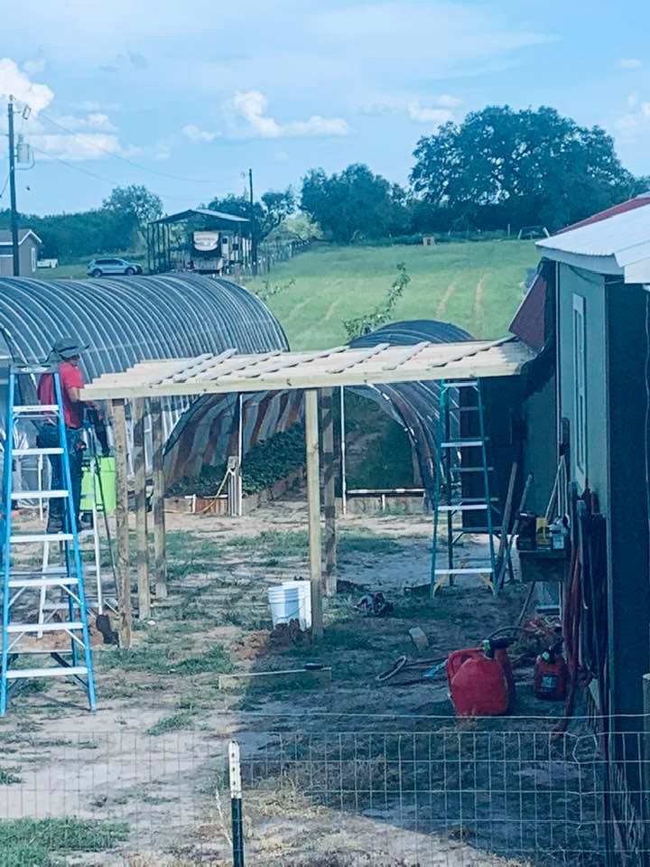 Nacho and his helper started the lean to for the new mower late in the afternoon.