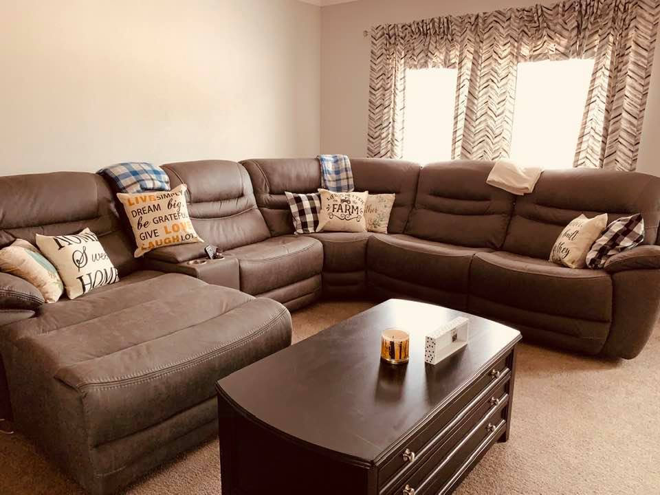 Our new living room furniture and new pillows. The end tables and one lamp are still not here.