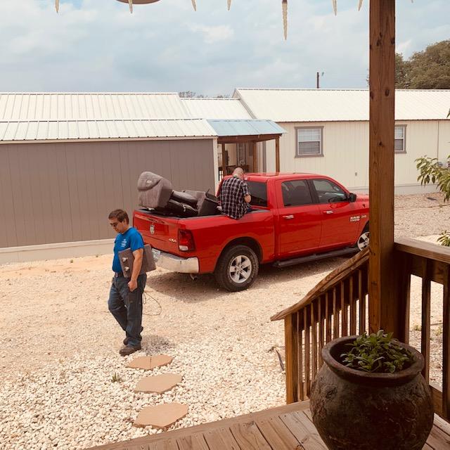 Brendon and Matt getting loveseat loaded up on our truck.