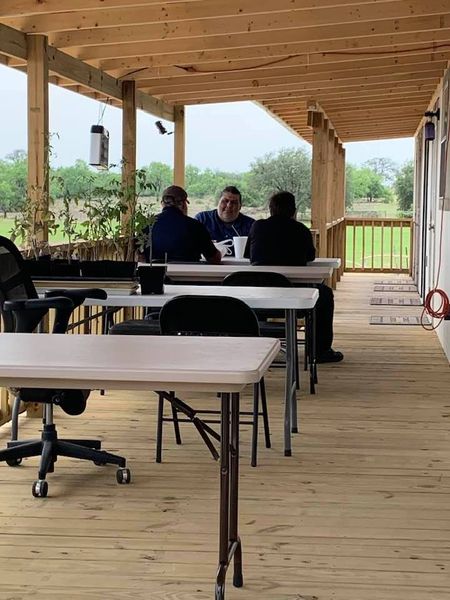 Here is the deck between the 2 buildings. Beyond our property is a hay field. We may get to buy that hay field soon, or at least a part of it.