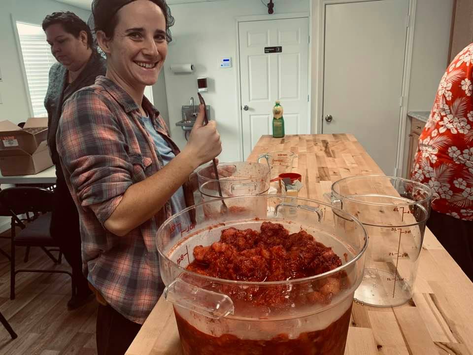 Linda is stirring the berries. Karen and I went to investigate and David is getting jars ready to be sanitized.