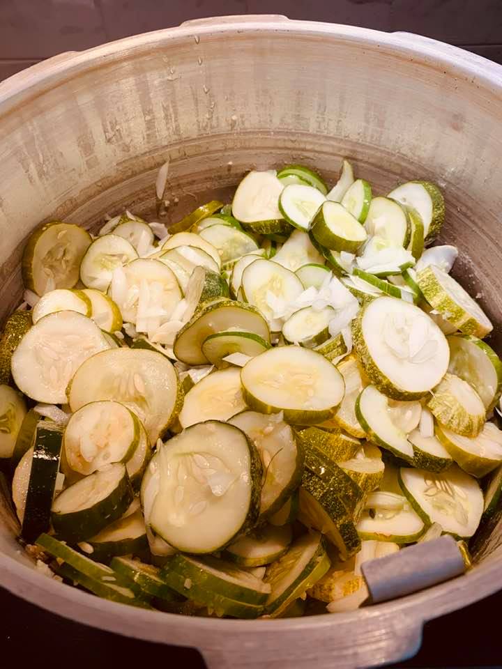 To make pickles, slice up the cukes and add onions and seasoning.