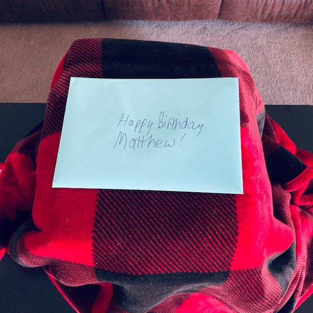 A nice card on top of his blanket-wrapped gifts. Happy Birthday, Son!