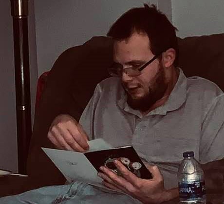 Matthew opening a birthday card.