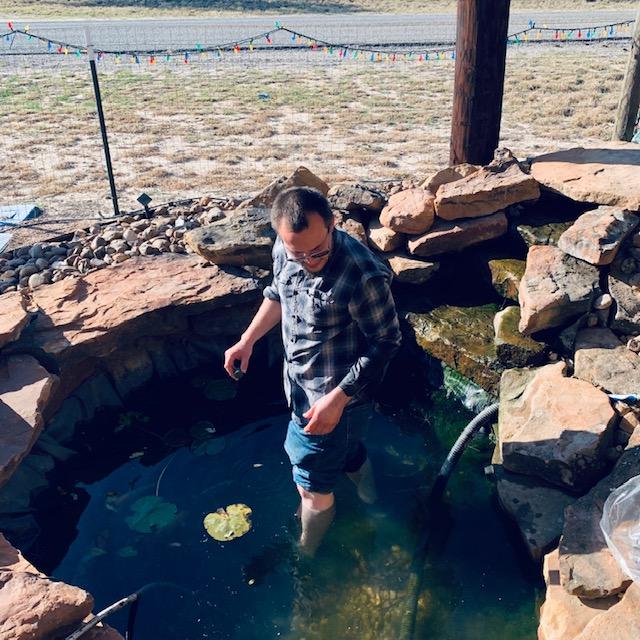 It is 88° and Matt is taking a dip...cleaning out algae.