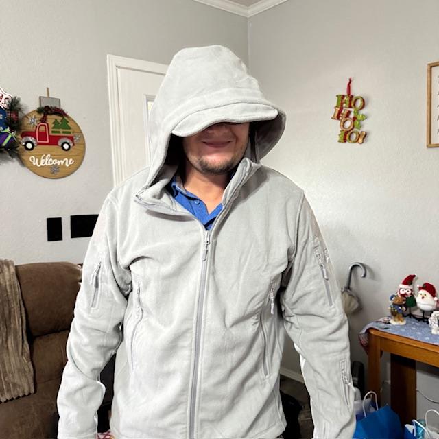 Matt in his tactical hoodie. The hood is big but the rest fits him well. The thing is loaded with pockets inside and out.