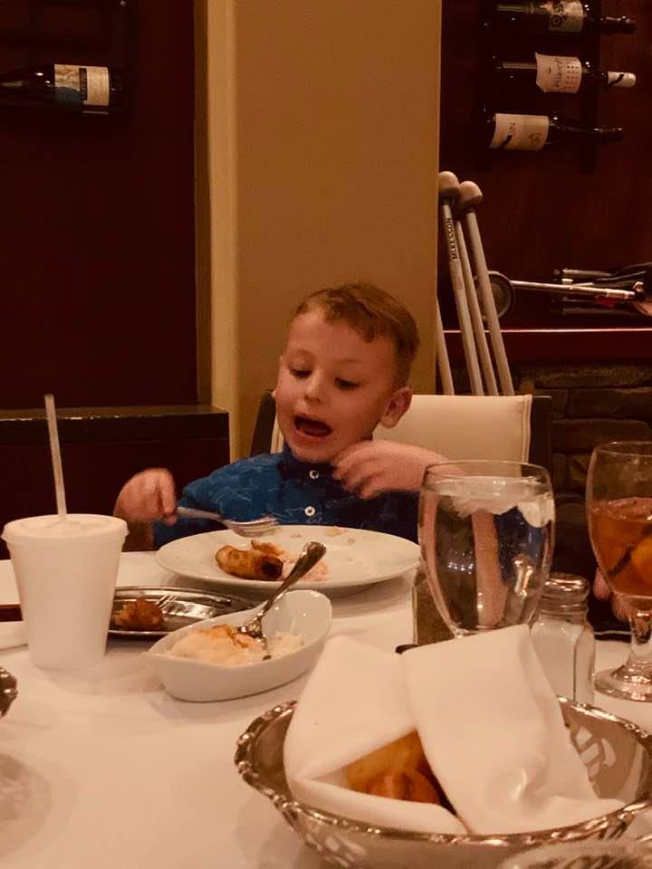 Max having fun at the Chama Gaucha table. The food was delicious.