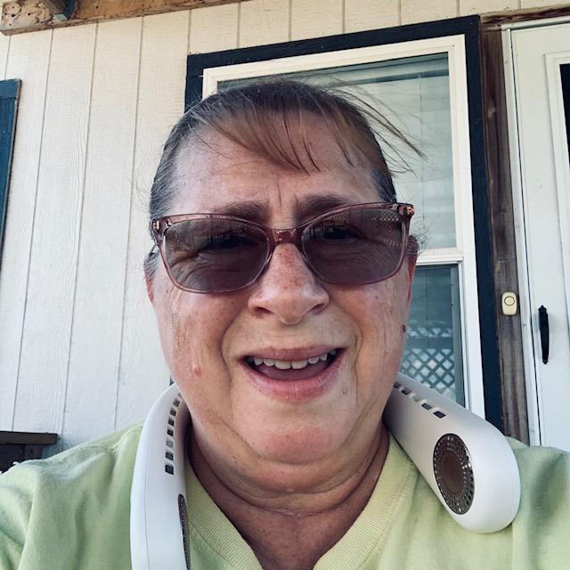 Sopping wet me after giving animals treats and collecting eggs in the 103° heat. What a mess!