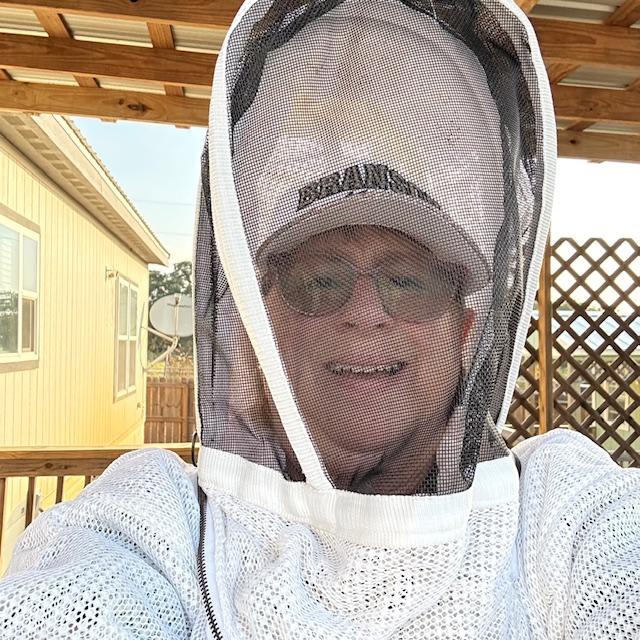 Me in my bee suit all ready to harvest some honey. Everyone else was late and I roasted in my bee suit.