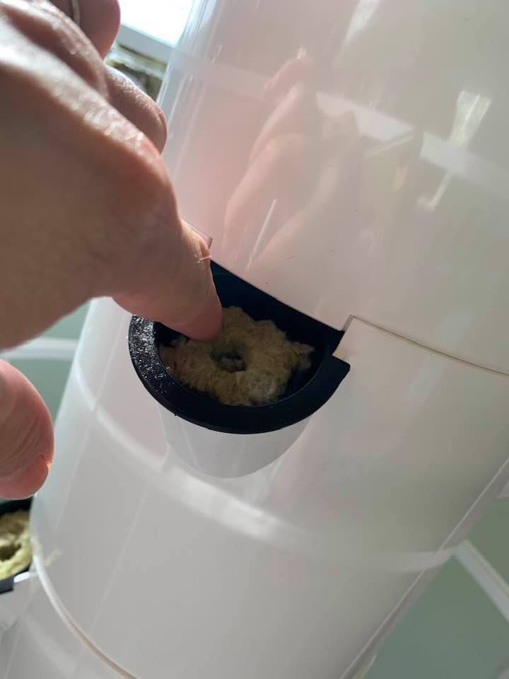 In the grow tower, water circulates, wetting the grow media so the seed can germinate.