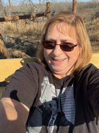 Me sitting on the bench at the top end of the property, out in the back forty.