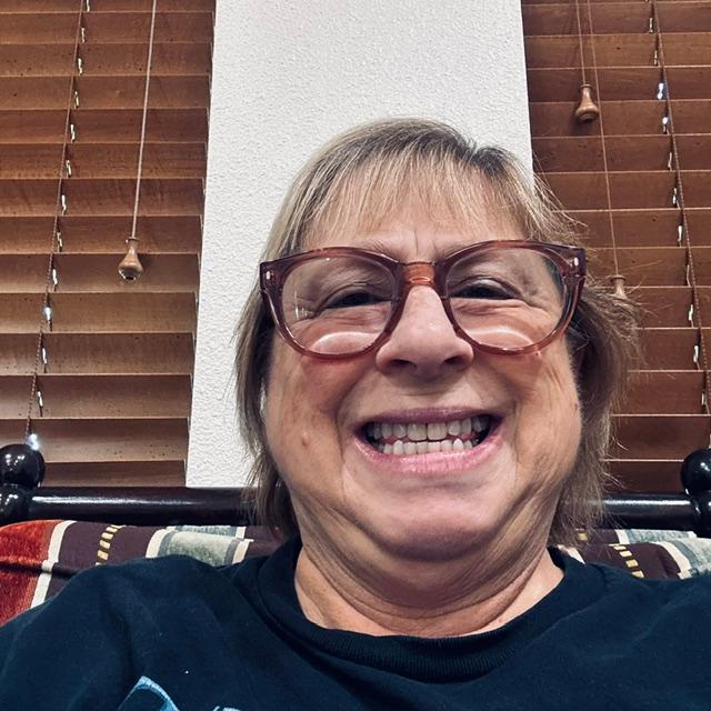Waiting for David in the dental office lobby, showing off my clean teeth! Ha ha!