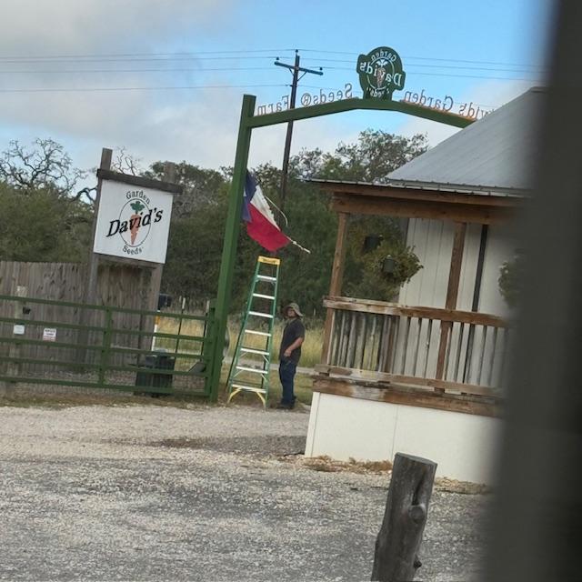 Matt actually had to get a taller ladder and I had to go out and hold it while he switched out the flags. It is HOT out there!
