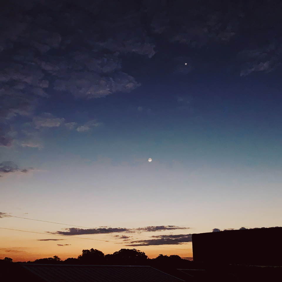The moon is out at sunrise on 9/15/2020.