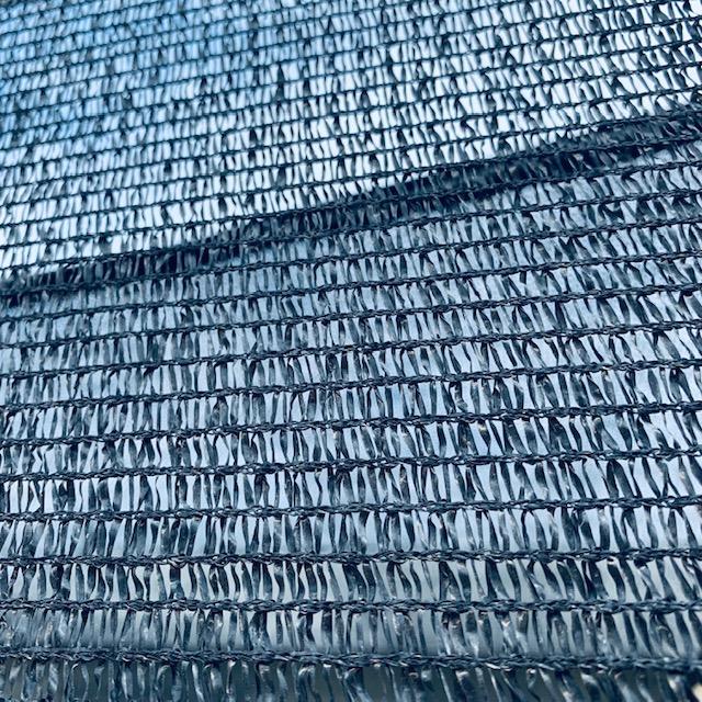 This is a close up of some shade cloth. It comes in a number of percentages that block sun exposure. This is a close up of some shade cloth. It comes in a number of percentages that block sun exposure.