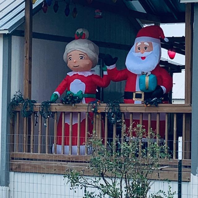 Santa and the Mrs. are out on the deck to wave as you drive by. Santa and the Mrs. are out on the deck to wave as you drive by.