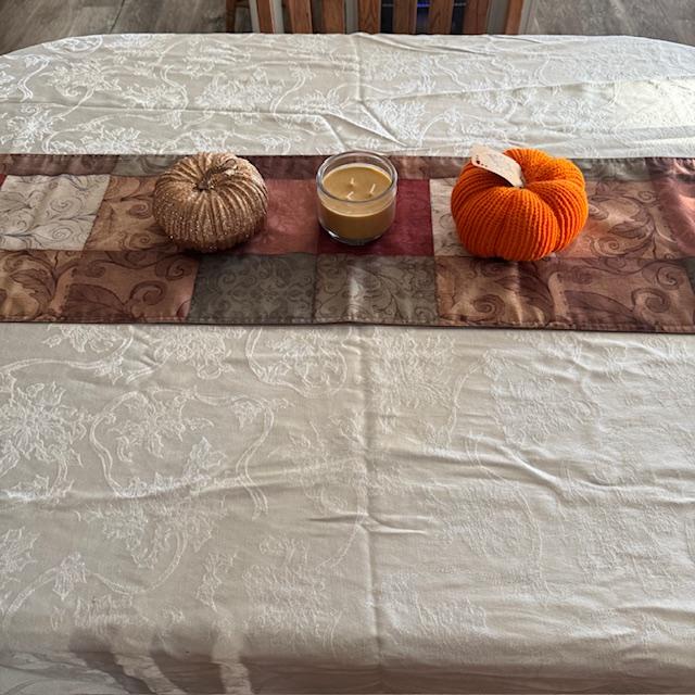 I decorated my kitchen table for Thanksgiving. Despite the wrinkles, I think it looks festive.