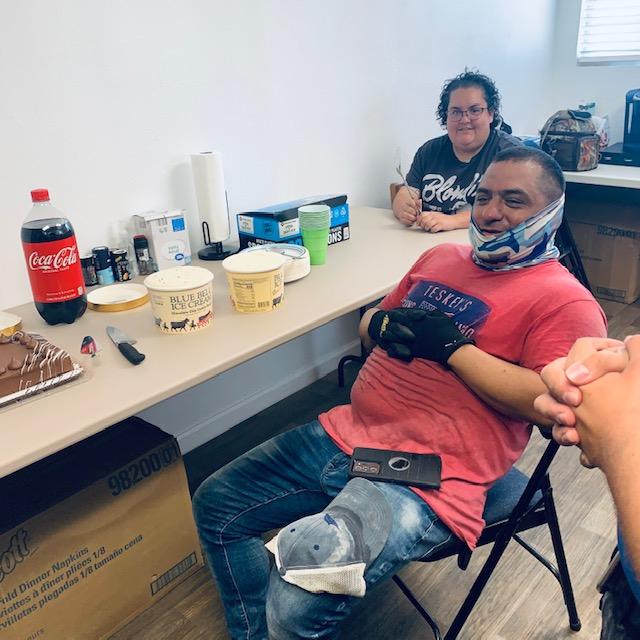 We got Nacho a cake and ice cream since today is his birthday. Shay is also at the table. The rest of us stood around.