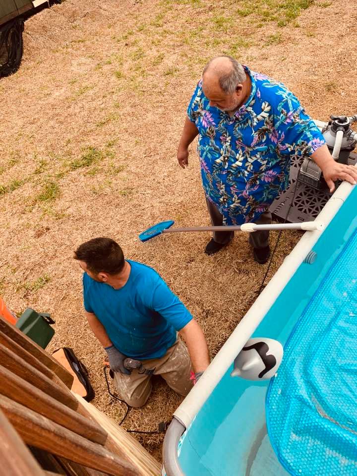 Contractor with David out by the new deck.