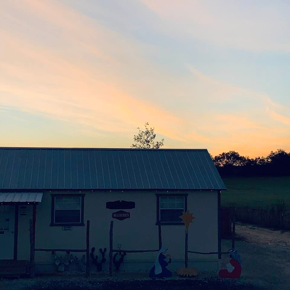 As the sun sets in our parking lot, Mary holds baby Jesus while Joseph observes from afar. This is just one of our many Christmas decorations. As the sun sets in our parking lot, Mary holds baby Jesus while Joseph observes from afar. This is just one of our many Christmas decorations.