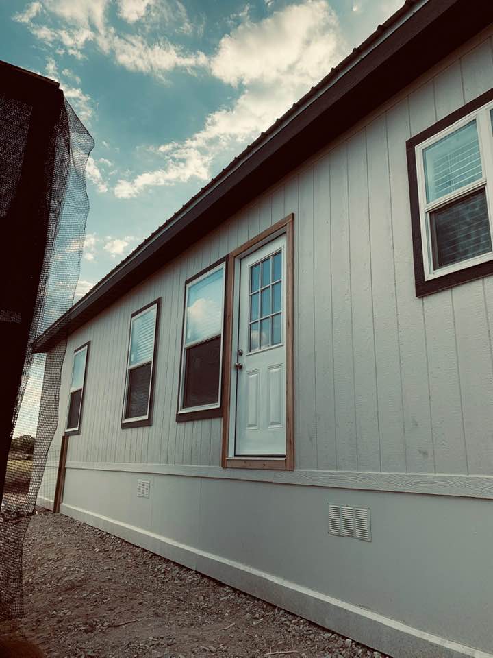 This is the new backdoor of our double wide manufactured home. It opens in the kitchen area. We took out a window to put the door in.