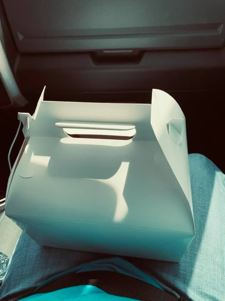 There are some sweet baby chicks in this white box!