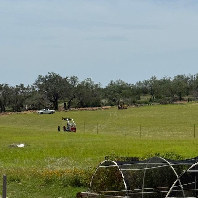 There was a whole team of workers putting in fence posts today. They have been digging up grass and things for a week and also took out part of our back fence. There was a whole team of workers putting in fence posts today. They have been digging up grass and things for a week and also took out part of our back fence.