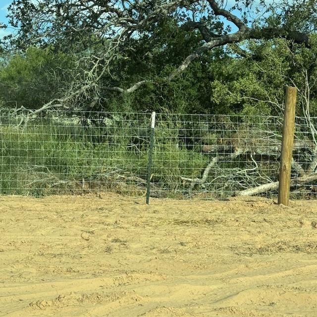 Our new fence extends about 186 feet across the back of the new property, from the corner of our fence post to right next to the neighbor's but it is not tied to it.