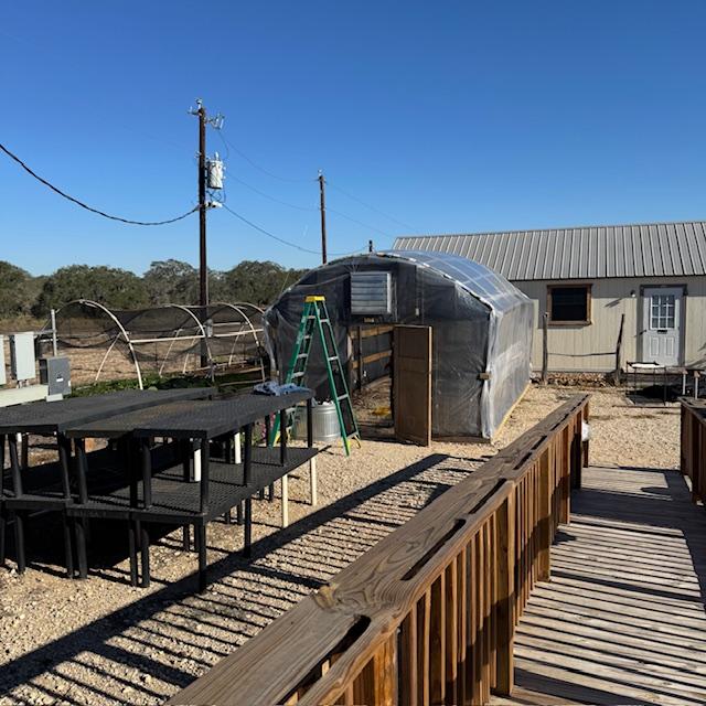 The new greenhouse in the front is coming along.
