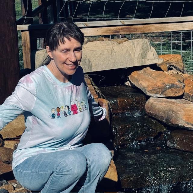 Norma enjoyed feeding the fish each day while she was here.