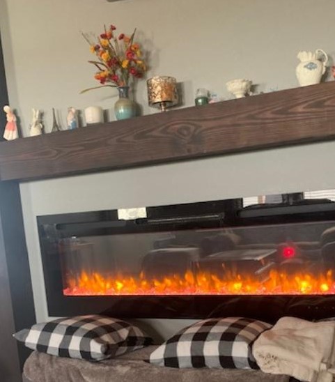 Now we are ready for Thanksgiving with the appropriate fireplace colors. We love this electric fireplace.