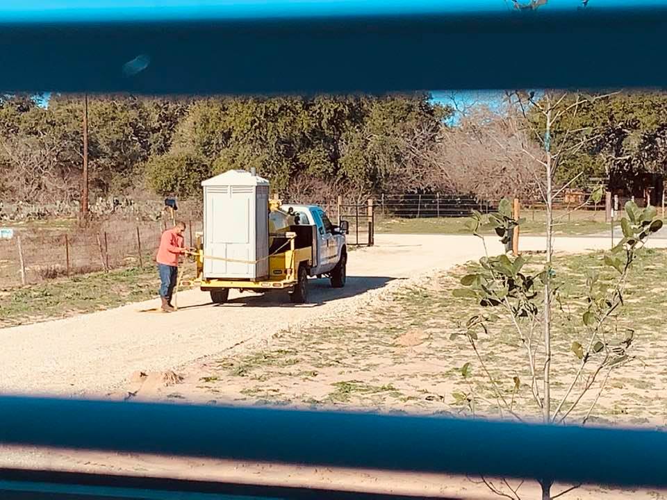 This lovely grey outhouse showed up in our front yard this morning.