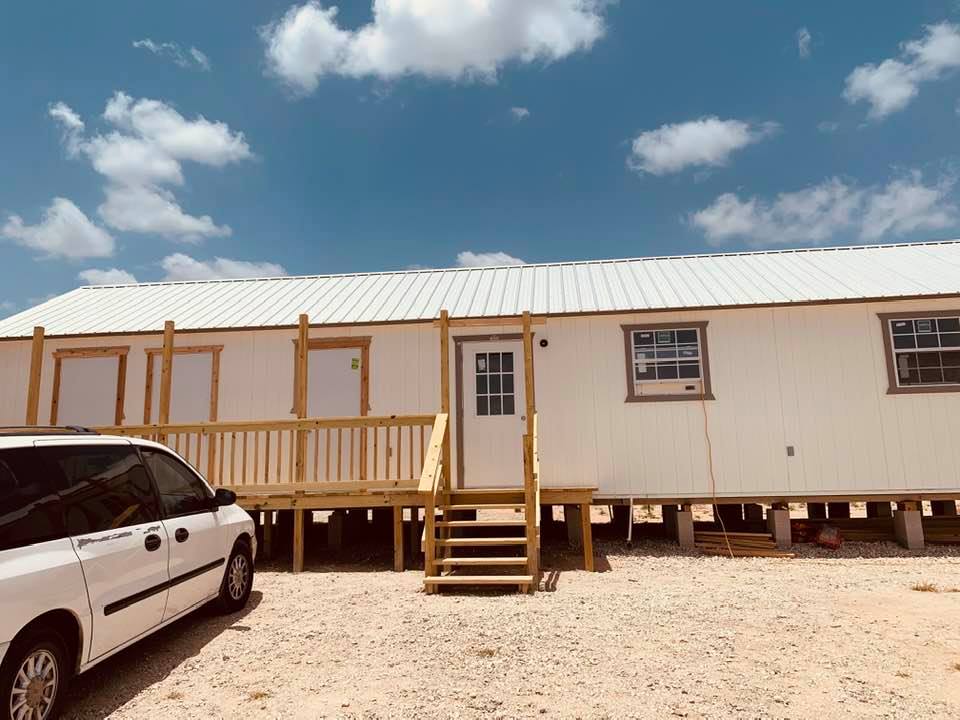 As the outside of the building looks now with 2 doors on left for restrooms, an employee entrance to break room, and the next entrance for the commercial kitchen and David's office.