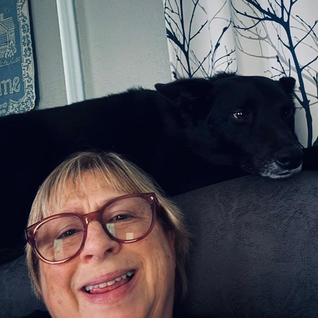Pamela sat up behind my head because the rest of the sectional was empty.