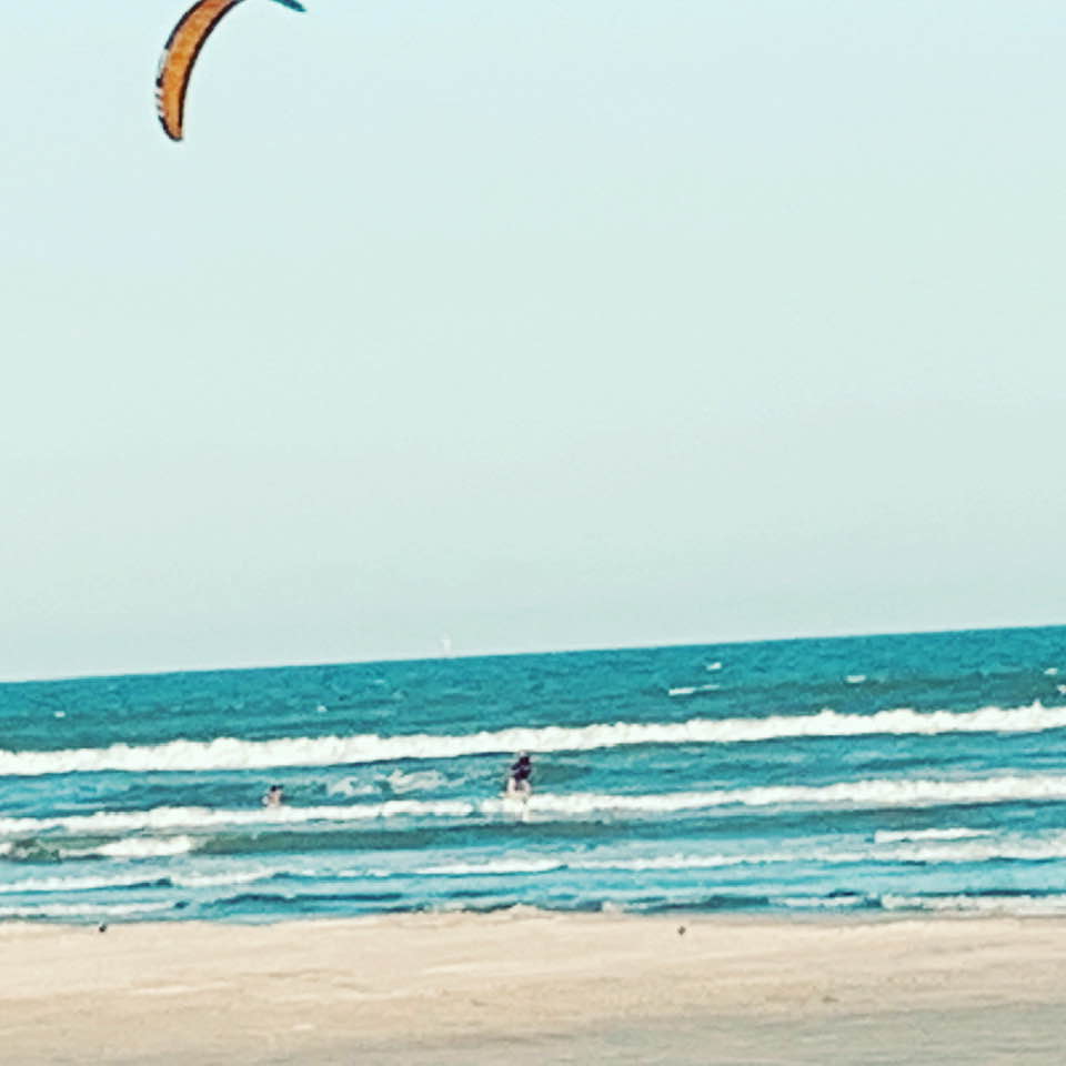 Three guys were parasailing in front of our condo. It was so cool to watch.