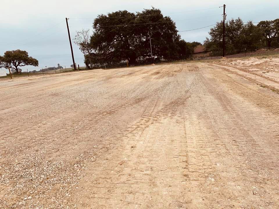The newly finished garden shop pad and parking lot in our front yard. It is all set for the store building. The newly finished garden shop pad and parking lot in our front yard. It is all set for the store building.