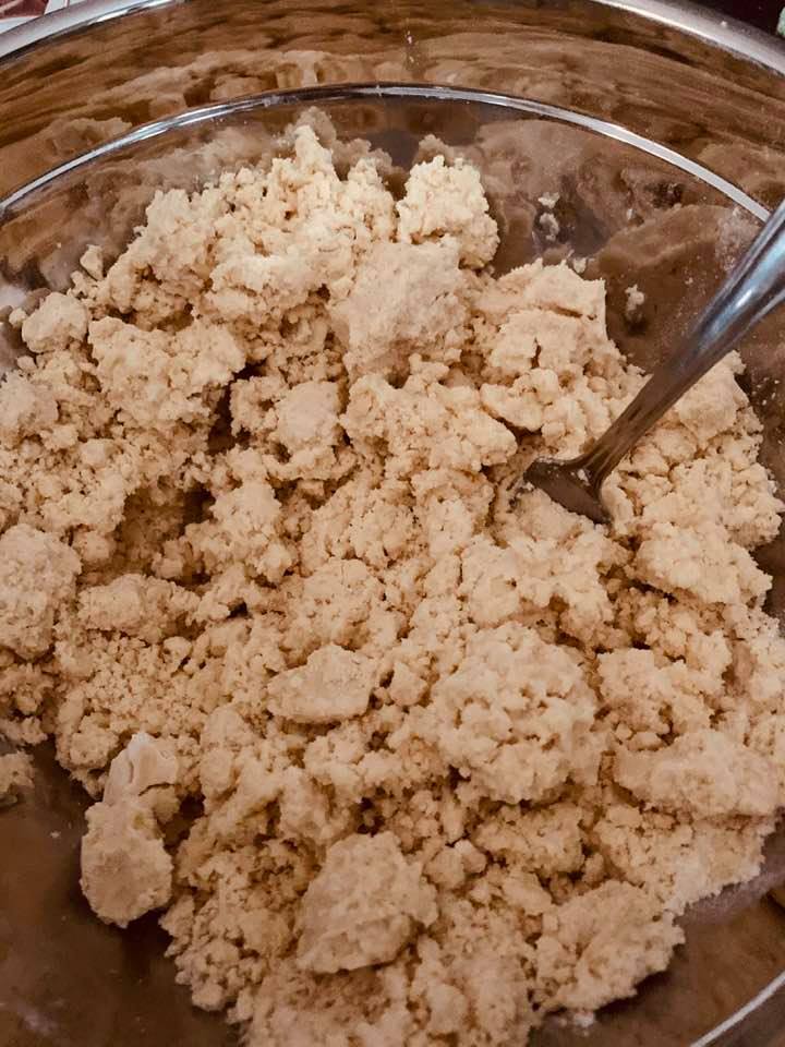 Once you've added your water to the dough, stir with a fork until all of the water has been stirred in to the dough. Once you've added your water to the dough, stir with a fork until all of the water has been stirred in to the dough.