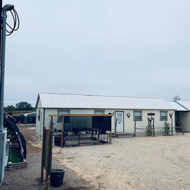 Our plant area and Fulfillment Building are in this photo taken from the gazebo. The plants inside are for sale. We have a few herbs and house plants.