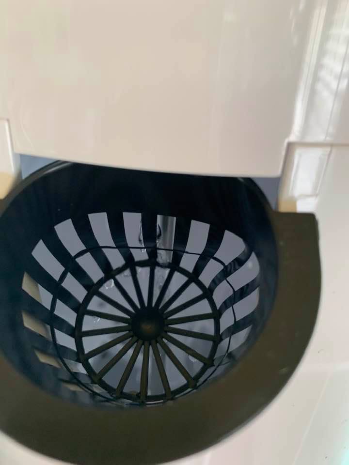 The media goes inside of a plastic cup that fits in the grow tower.