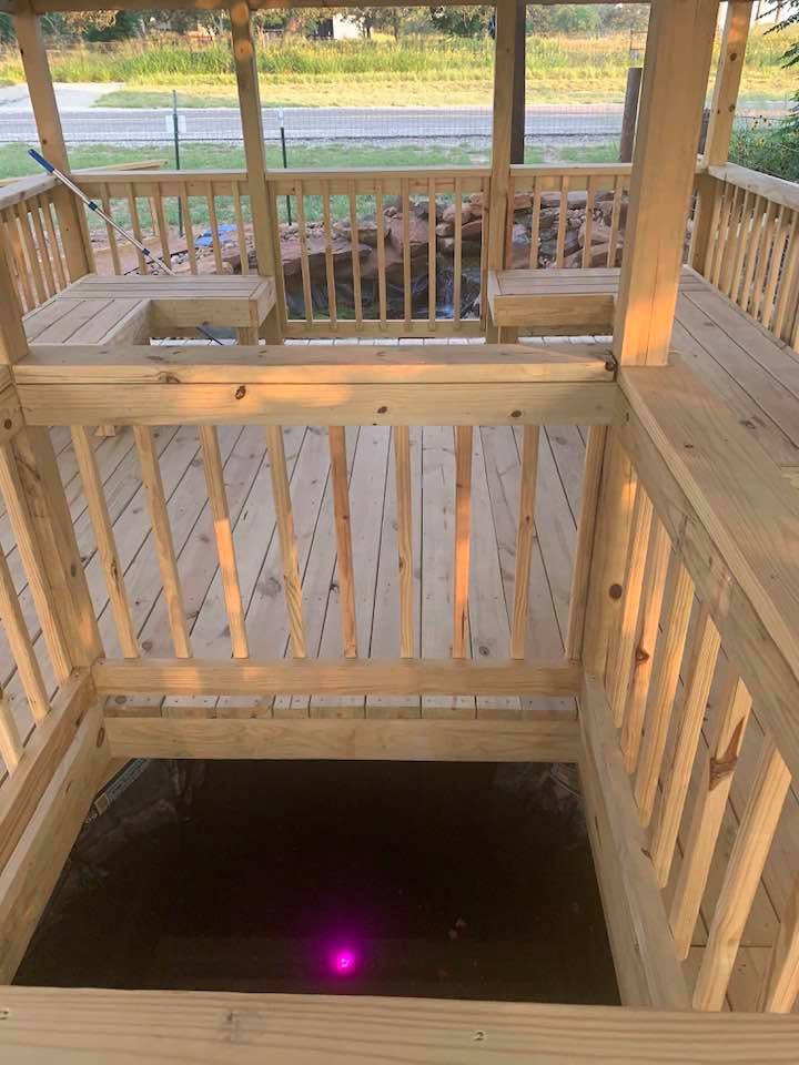 This is our two part pond with falls. One part is out and the other in the gazebo connected by a stream so the fish can go back and forth.