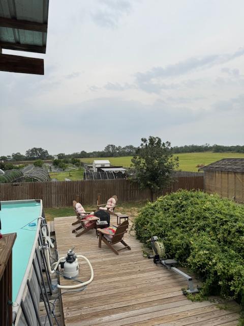 A shot of the field, chicken houses, and deck in our backyard.