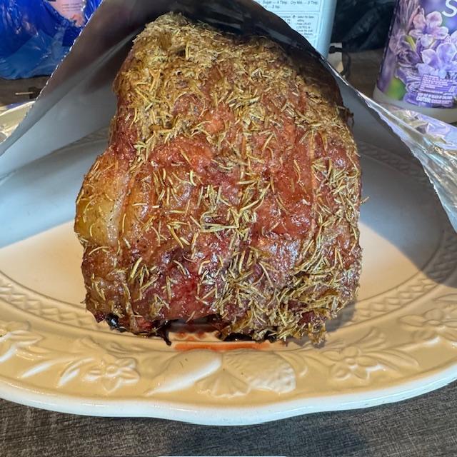 The prime rib was coated in butter, rosemary, and other herbs and put on the Traeger to smoke. It was delicious.