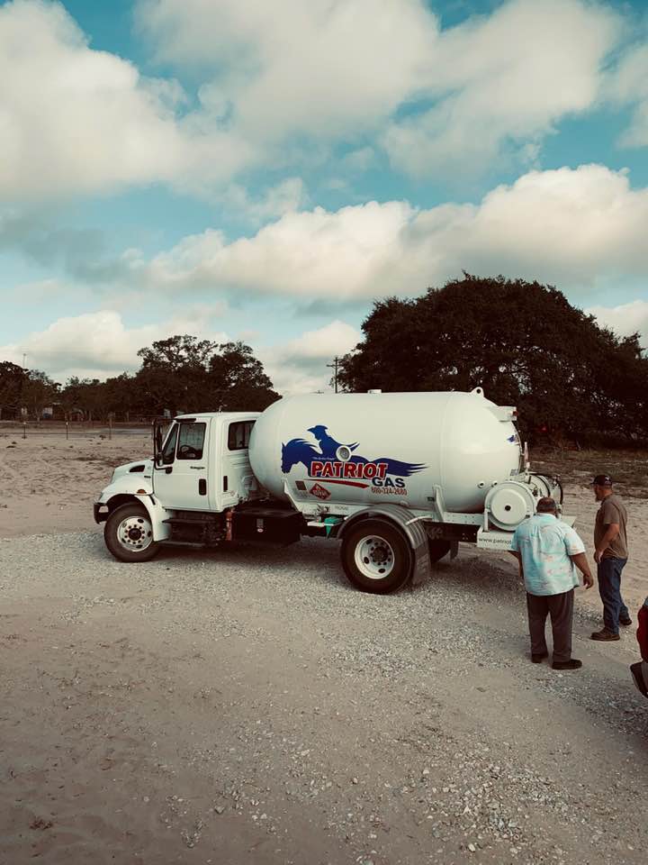 David is talking with the propane man. We were down to 5% in the tank so it was a little scary! We hope to get our electric soon.