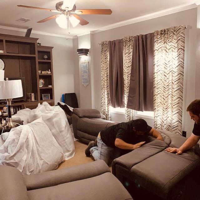 The furniture crew is assembling the sectional. They were such nice men and they were quick about it.