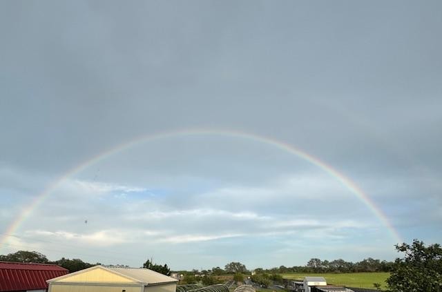 We had another double rainbow this evening. You can barely see the top one and this rainbow is not as bright as the last one but it is a full arc across the sky.